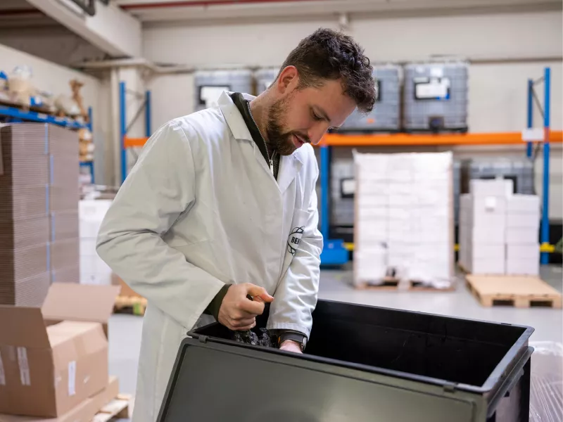 R&D taking a sample of a new compound to test in the lab